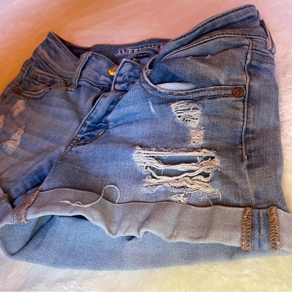 American eagle midi light blue distressed jean shorts